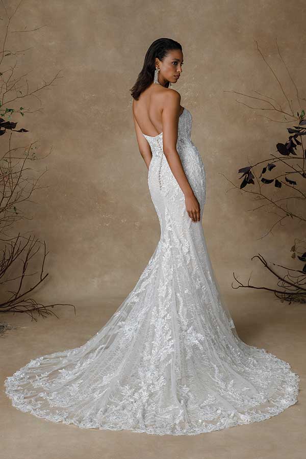 woman wearing lace mermaid bridal gown with no straps