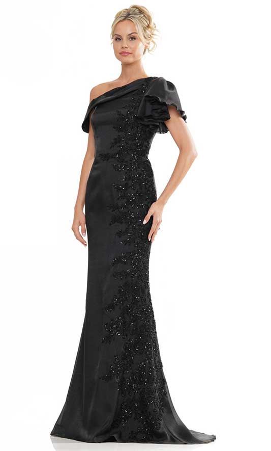 A woman wearing a black evening gown.