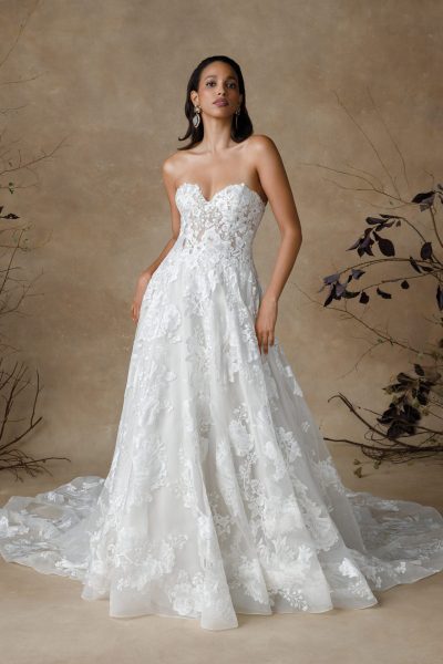 Woman wearing a strapless lace wedding gown (wedding dress trends)