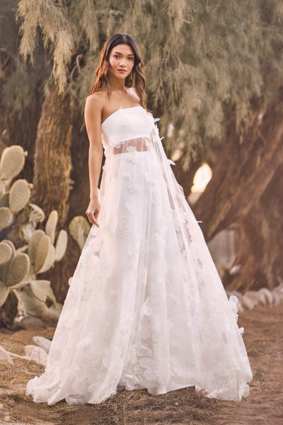 Woman wearing a two-piece wedding outfit. (wedding dress trends)