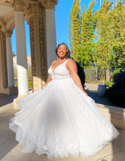 Woman twirling in a tulle ballgown (wedding dress trends)